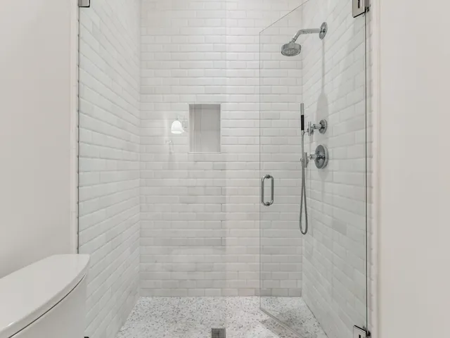 a bedroom with a bed and flat screen tv