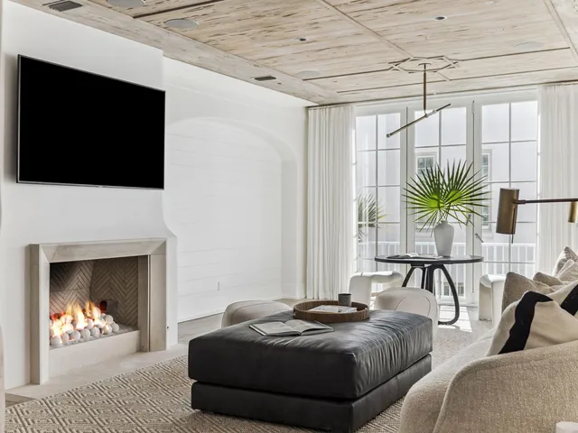 a bedroom with a bed and a fireplace