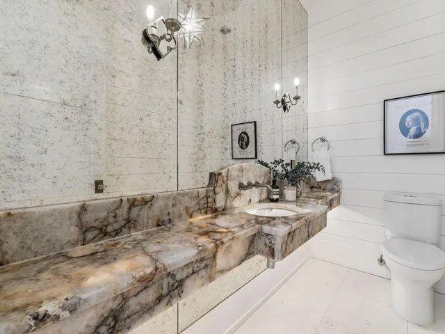 a kitchen with a sink a stove and cabinets