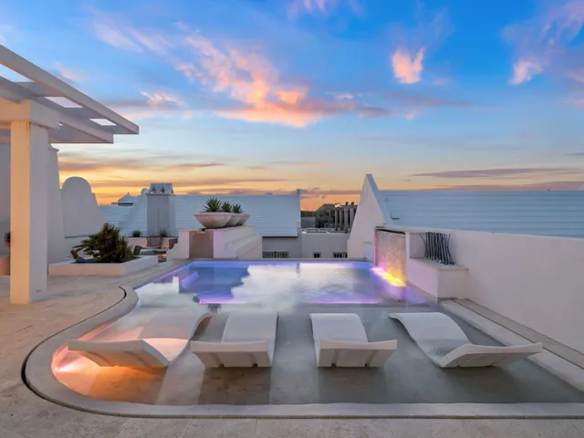 a view of a living room with furniture and a rug