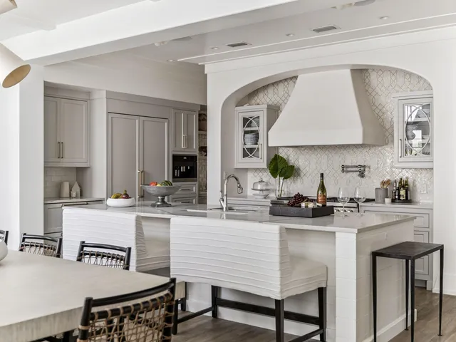 a kitchen with a stove a sink and a refrigerator