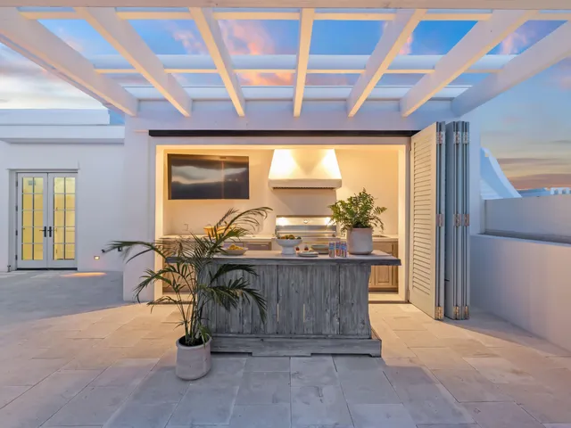 a terrace with outdoor seating and city view