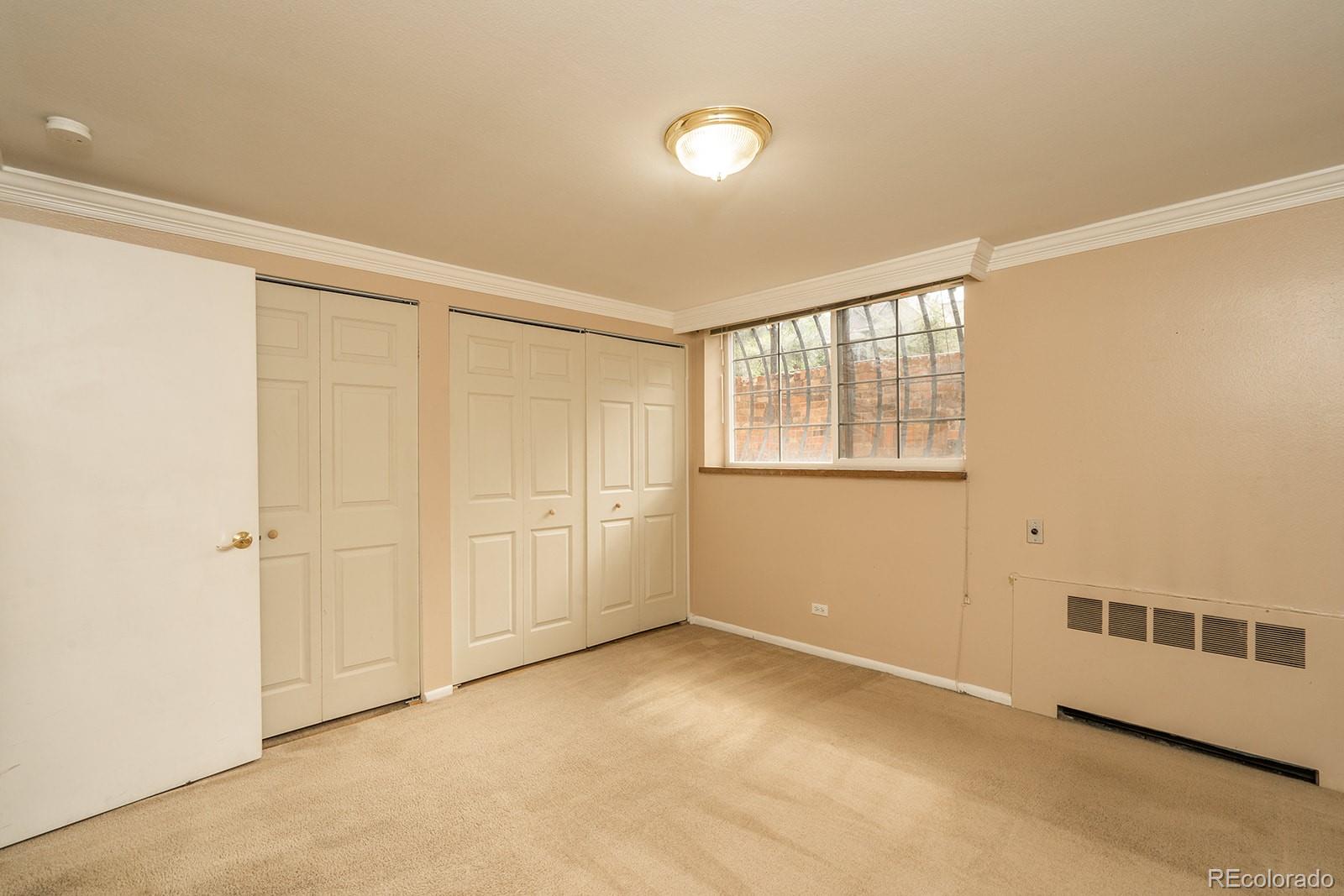 1350 Josephine Street, Unit 101 Denver, CO 80206 - Photo 6 of 13 a view of an empty room with a window