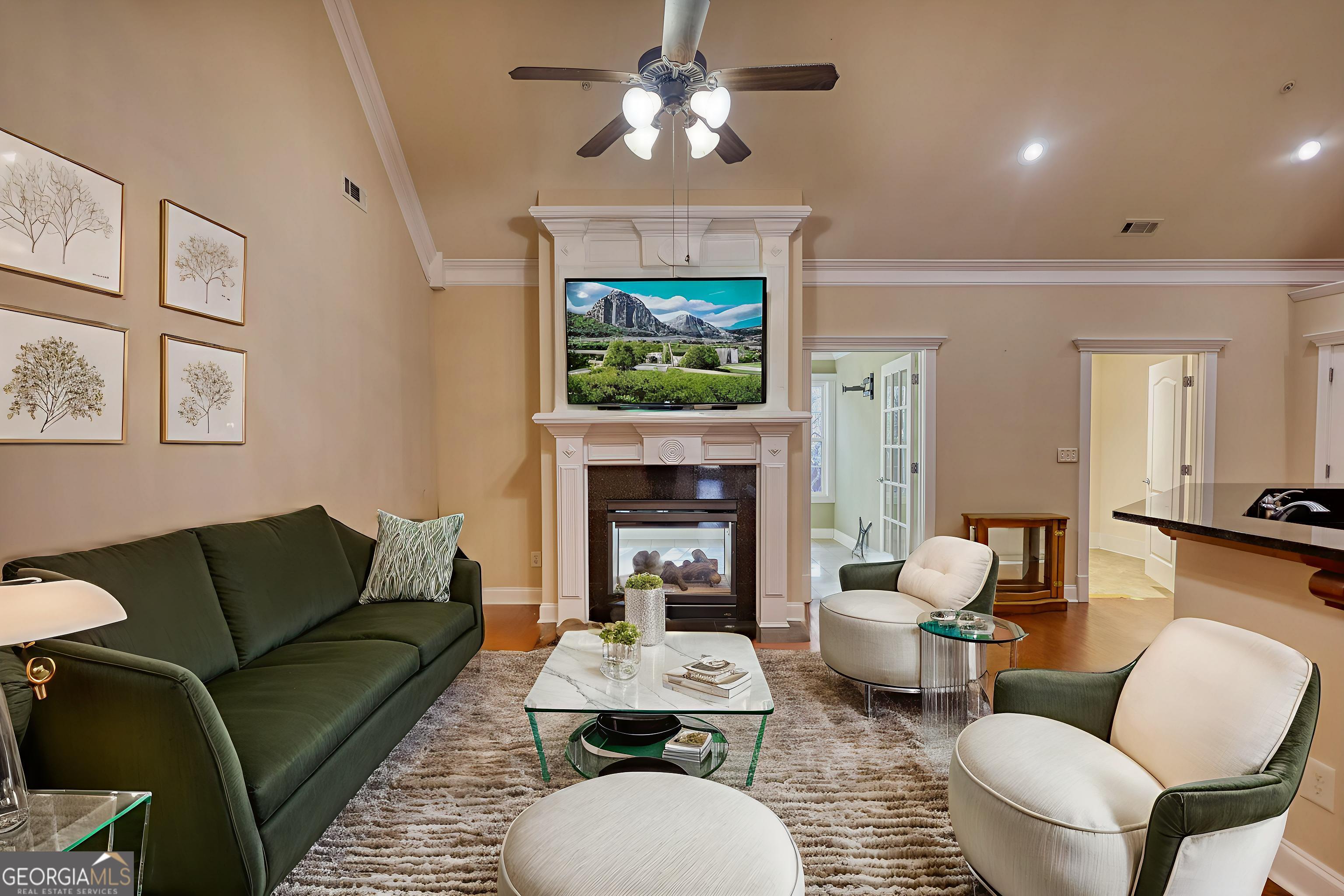 10110 Malcolm Court Covington, GA 30014 - Photo 15 of 60 a living room with furniture a fireplace and a chandelier