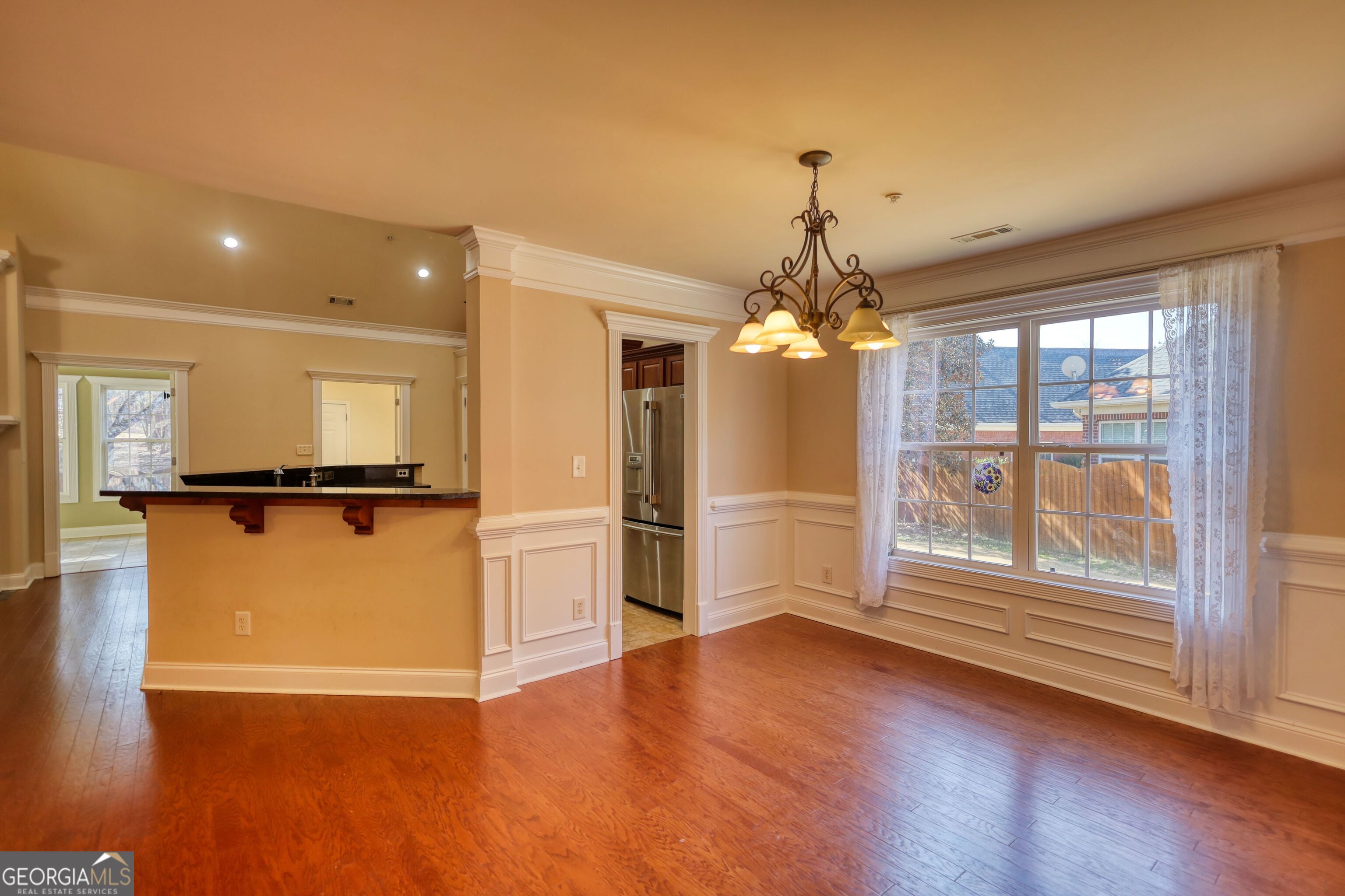 10110 Malcolm Court Covington, GA 30014 - Photo 21 of 60 a view of a room with wooden floor and a kitchen