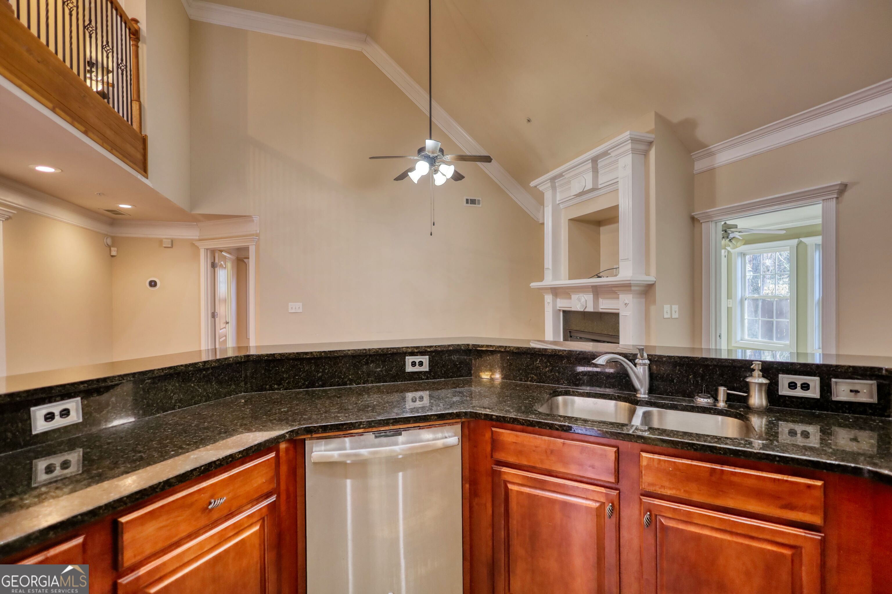 10110 Malcolm Court Covington, GA 30014 - Photo 26 of 60 a kitchen with granite countertop a sink a stove and cabinets