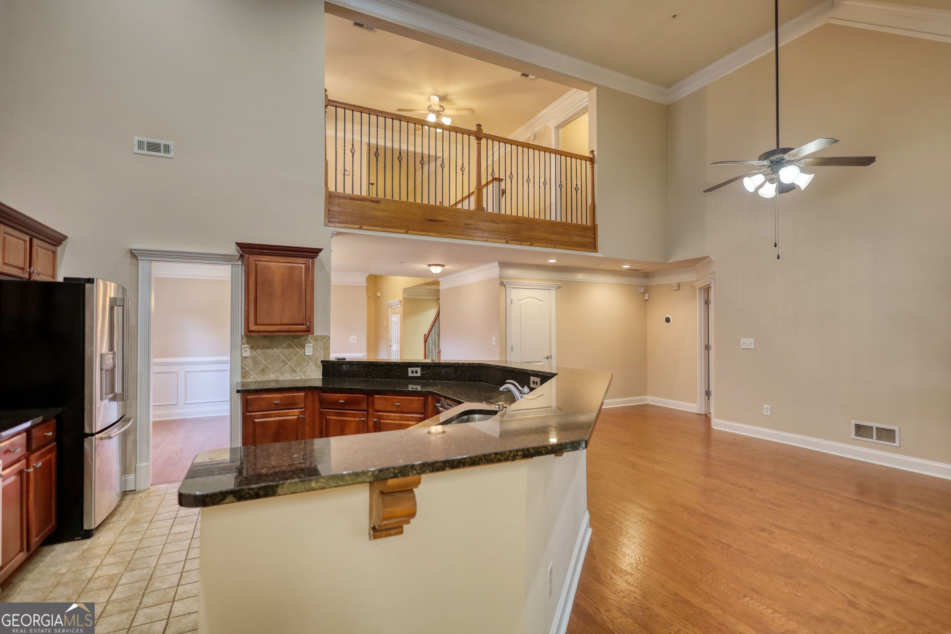 10110 Malcolm Court Covington, GA 30014 - Photo 29 of 60 a kitchen with stainless steel appliances granite countertop a sink a stove and a refrigerator