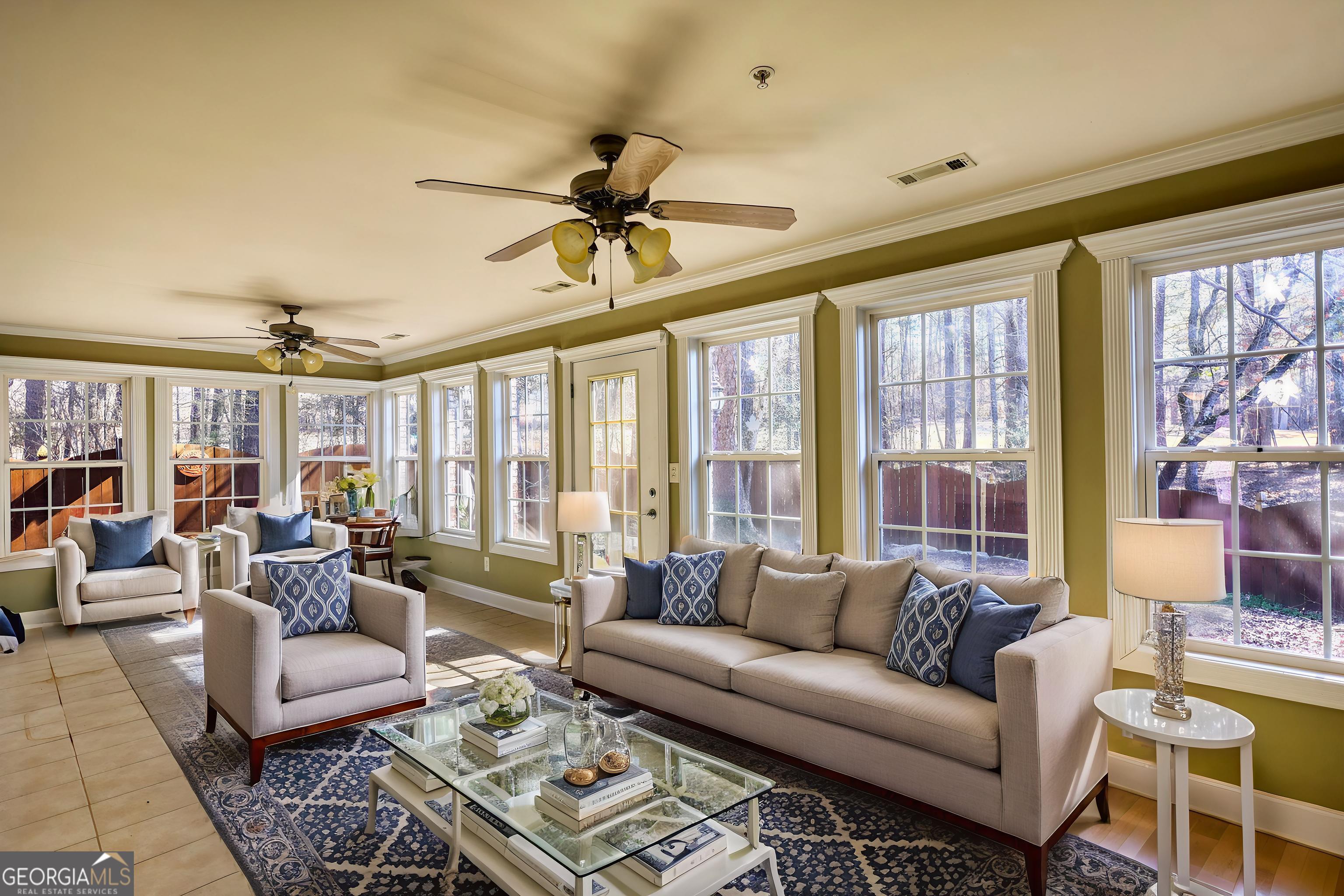10110 Malcolm Court Covington, GA 30014 - Photo 30 of 60 a living room with furniture and a large window