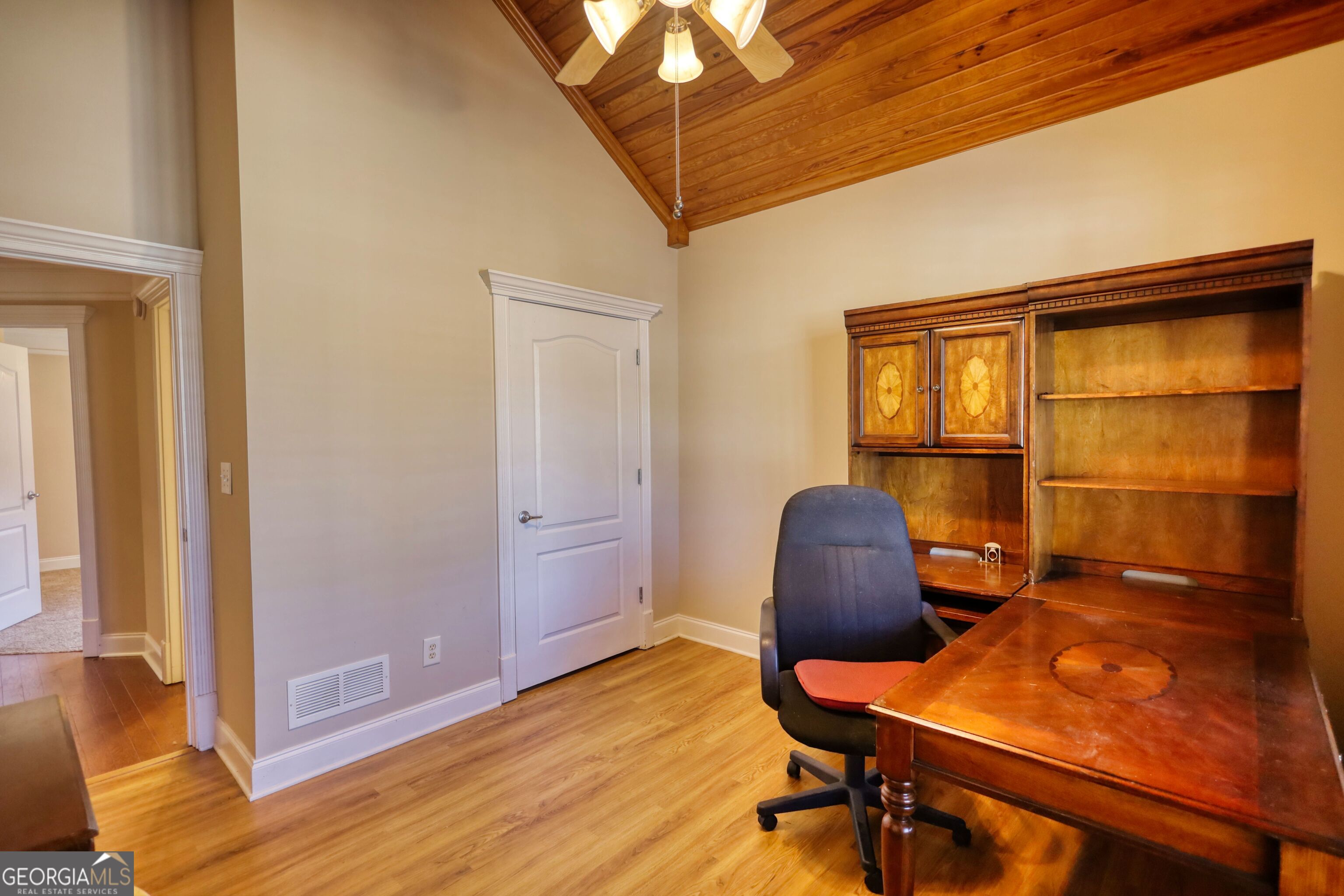 10110 Malcolm Court Covington, GA 30014 - Photo 35 of 60 a workspace with furniture and a window