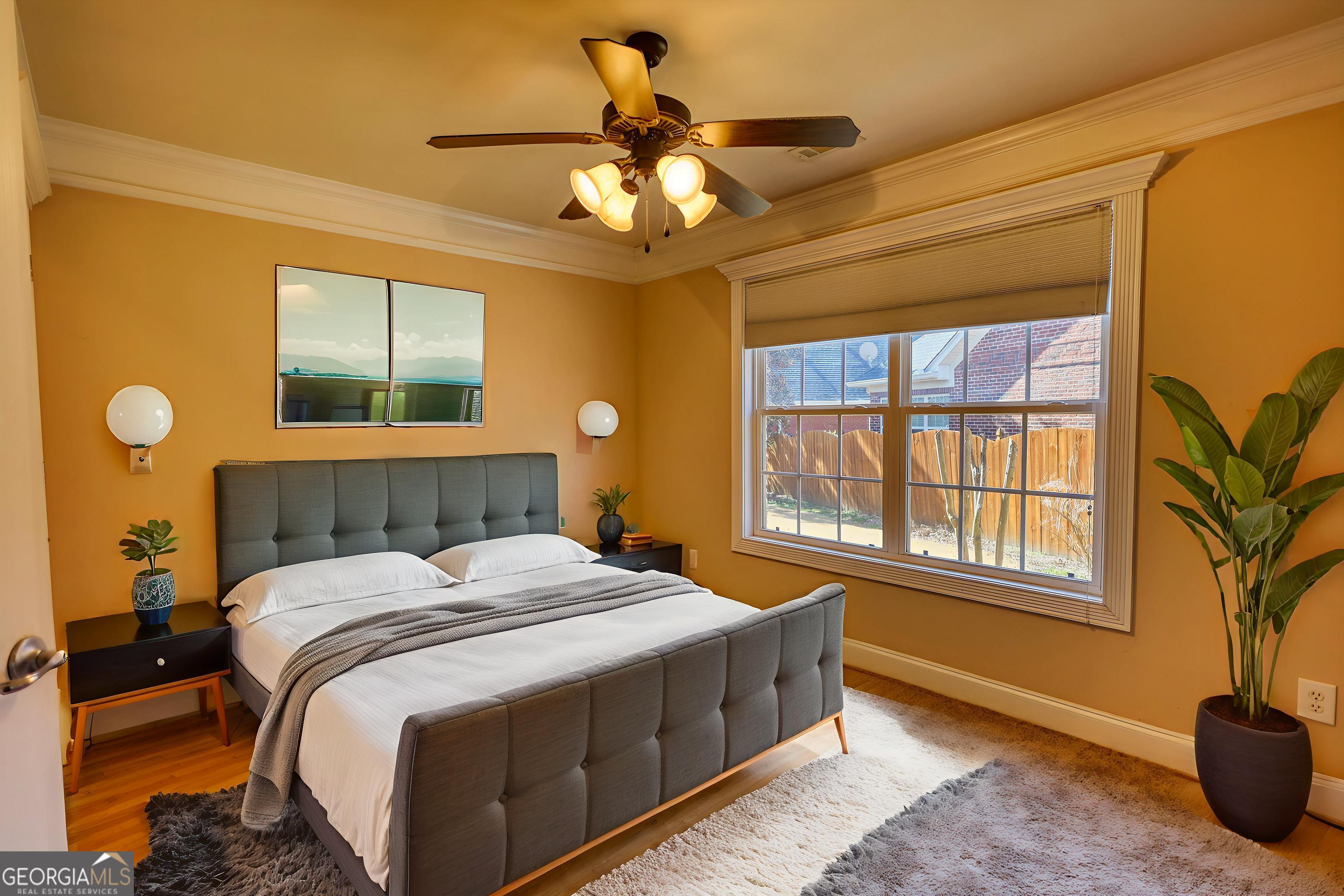 10110 Malcolm Court Covington, GA 30014 - Photo 36 of 60 a bedroom with a bed and a chandelier