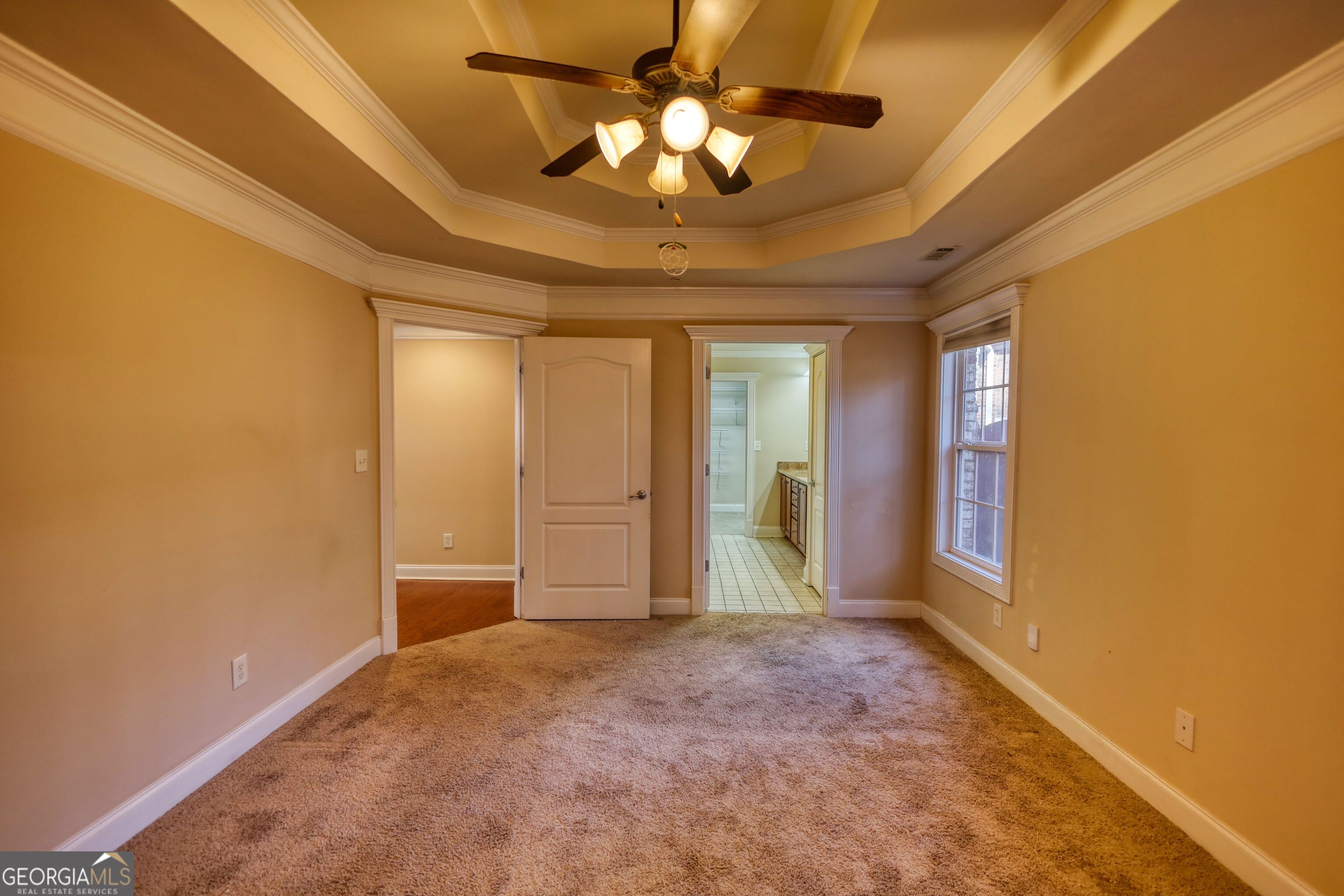 10110 Malcolm Court Covington, GA 30014 - Photo 40 of 60 a view of an empty room and chandelier fan and fire place