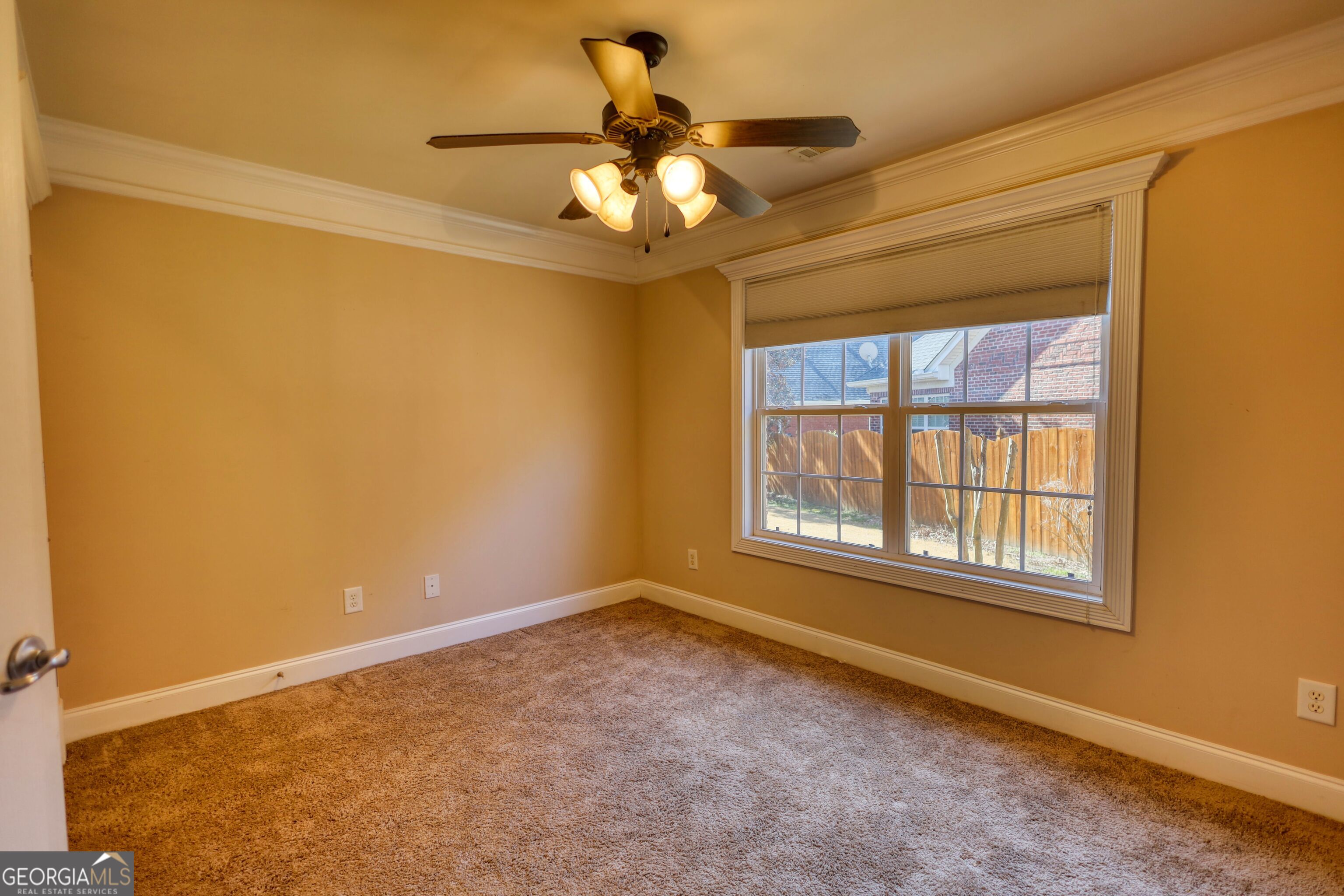 10110 Malcolm Court Covington, GA 30014 - Photo 46 of 60 a view of an empty room with a window