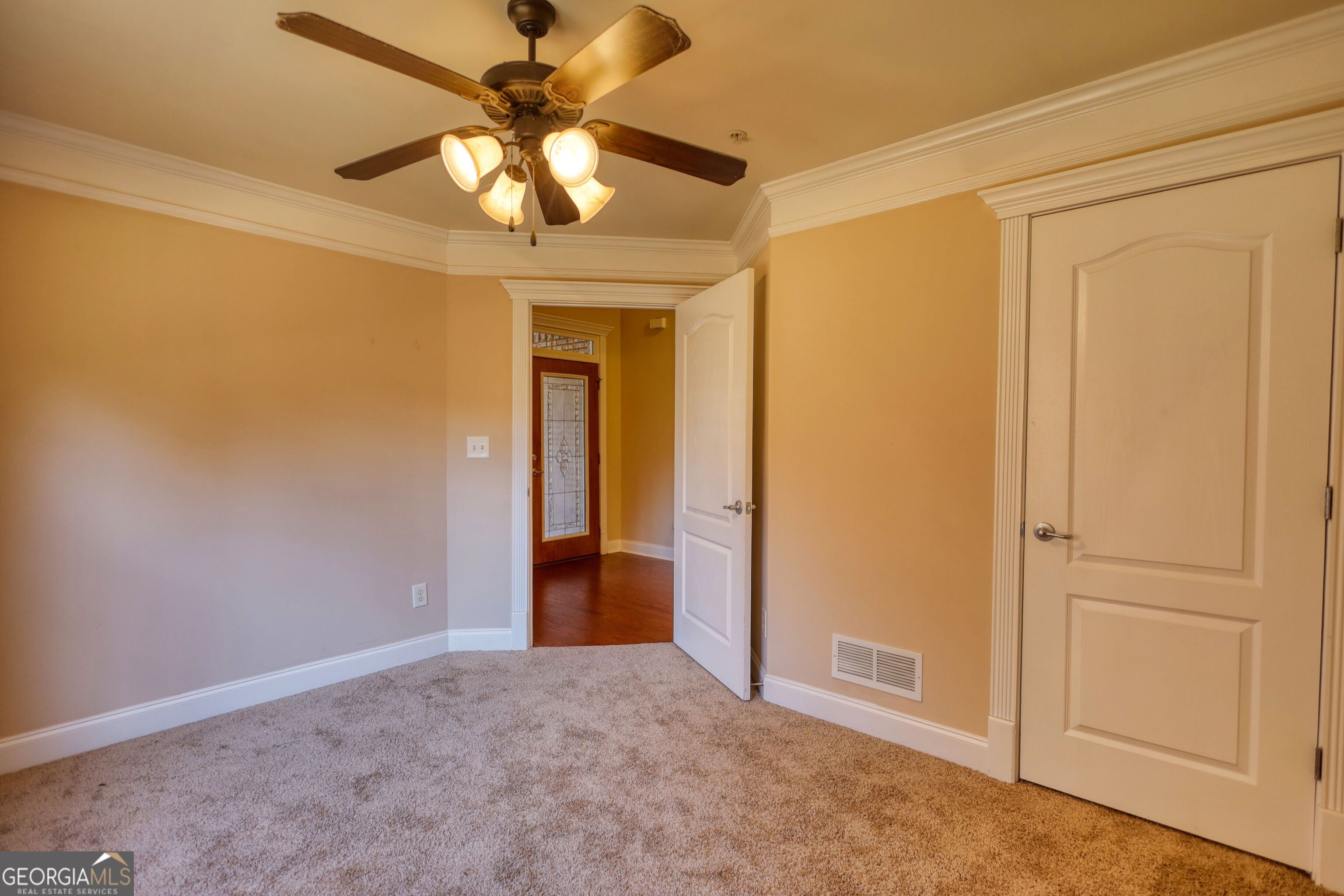 10110 Malcolm Court Covington, GA 30014 - Photo 47 of 60 a view of an empty room and a ceiling fan