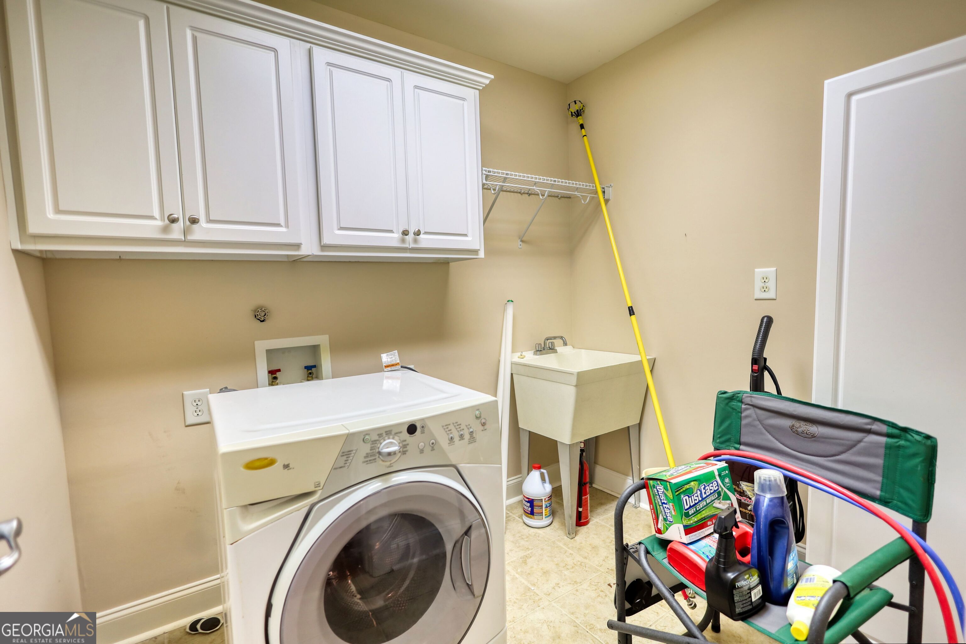 10110 Malcolm Court Covington, GA 30014 - Photo 48 of 60 a view of storage and utility room with washer and dryer