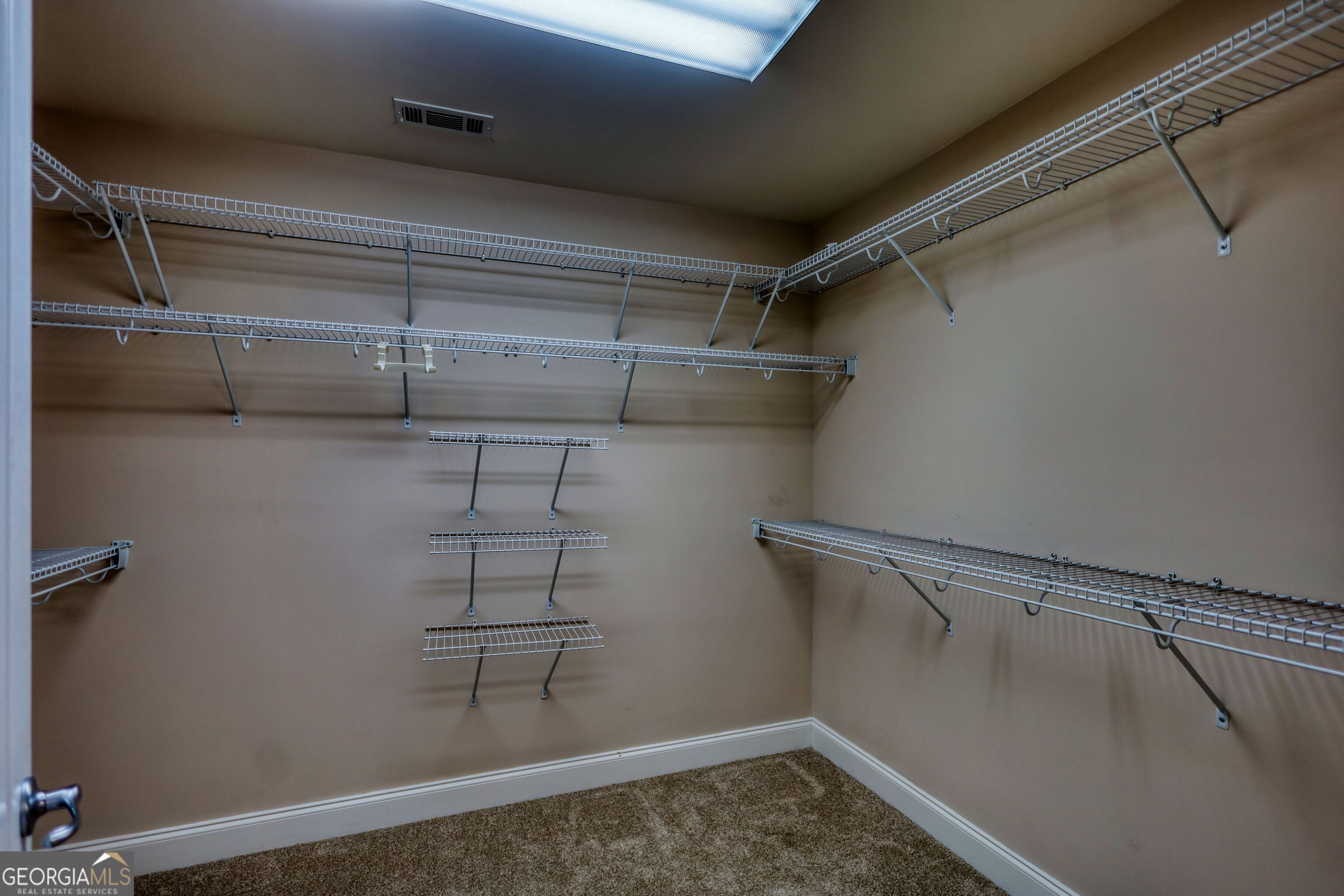 10110 Malcolm Court Covington, GA 30014 - Photo 55 of 60 a view of a room with racks on the wall