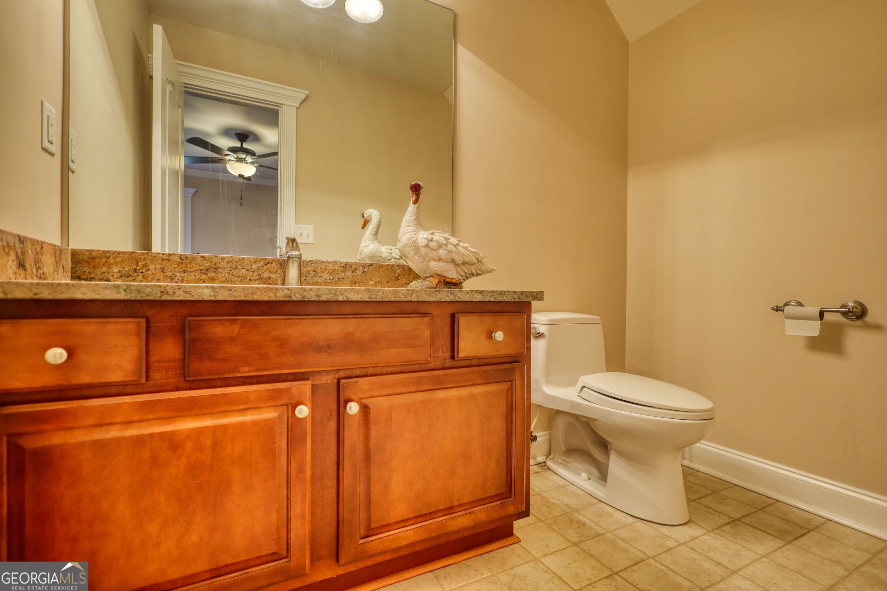 10110 Malcolm Court Covington, GA 30014 - Photo 60 of 60 a bathroom with a toilet and a sink