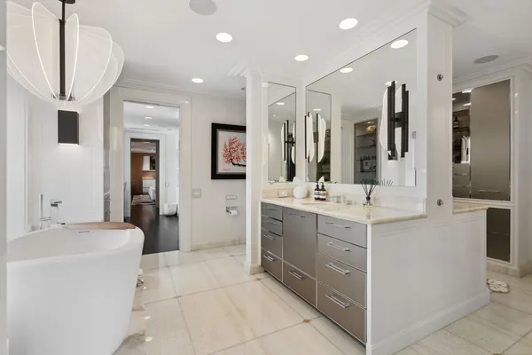 a bathroom with a double vanity sink a mirror and a shower
