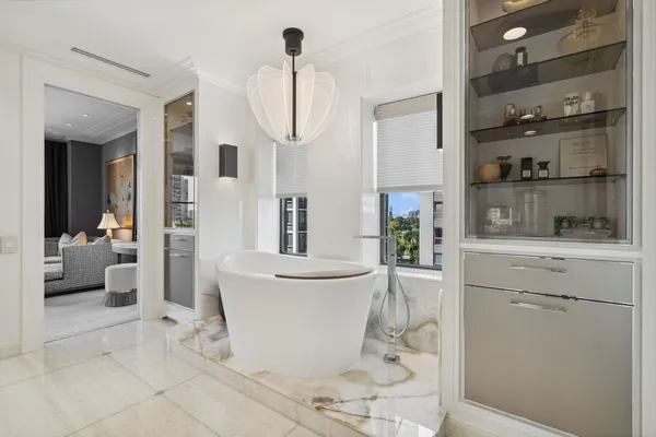 a room with a sink and cabinets