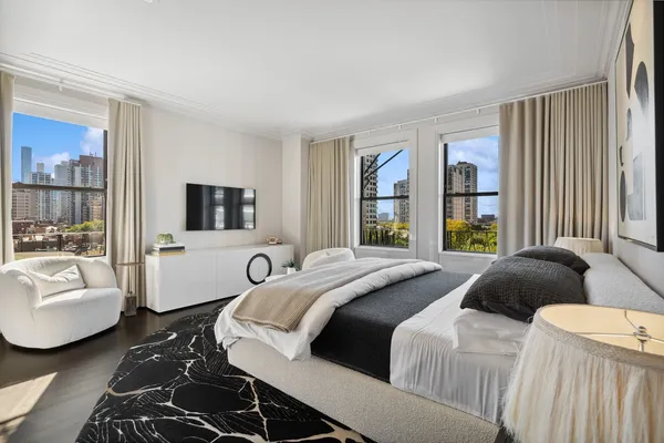 a bedroom with a bed and a couch