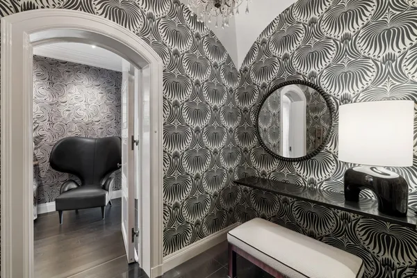 a bathroom with a toilet a sink and a mirror