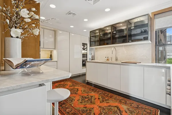a kitchen with stainless steel appliances granite countertop a sink and cabinets