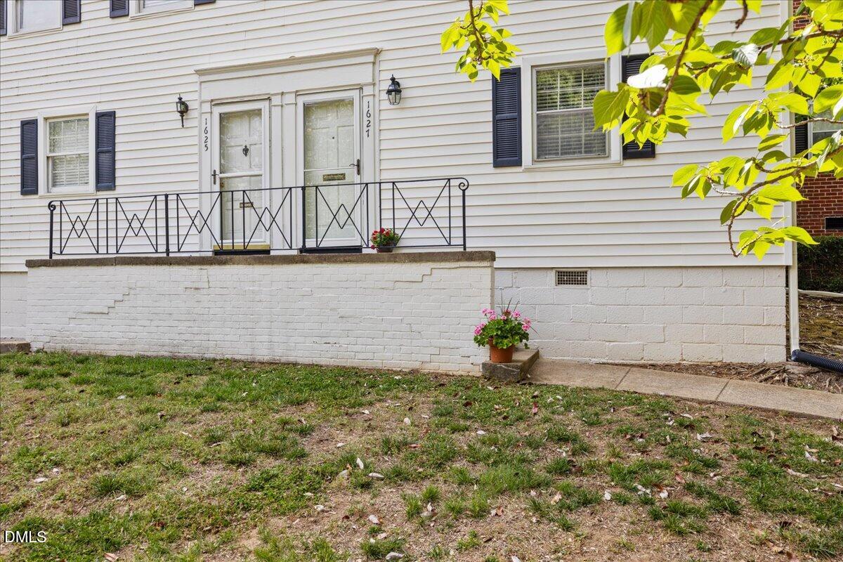 1627 Sutton Drive Raleigh, NC 27605 - Photo 3 of 33 a front view of a house with a yard