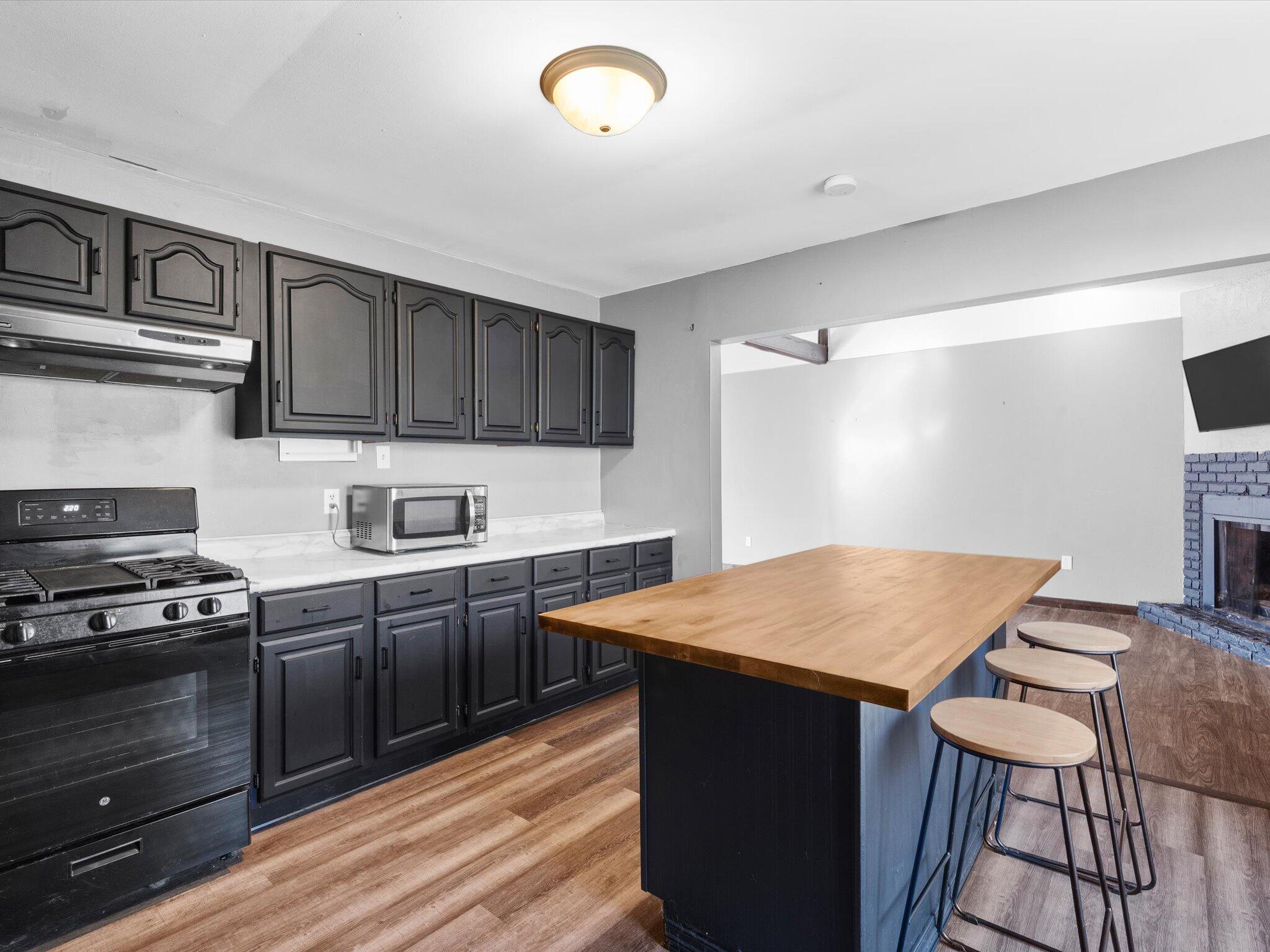 767-1 Heritage Road Valparaiso, IN 46385 - Photo 10 of 20 a kitchen with a stove a sink and a refrigerator