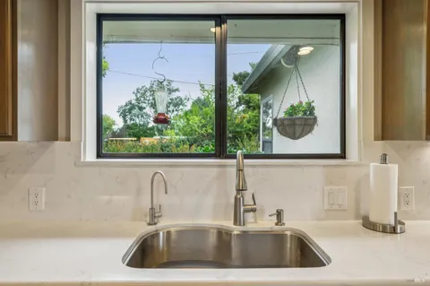 a bathroom with a sink and a large mirror