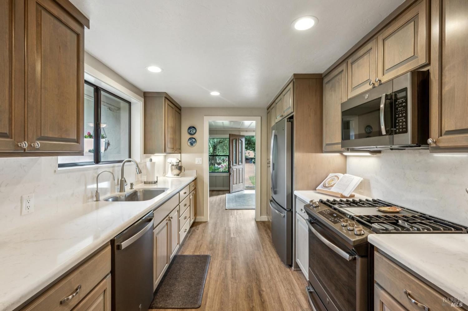 9760 Willow Avenue Cotati, CA 94931 - Photo 15 of 63 a kitchen with a sink stove and cabinets