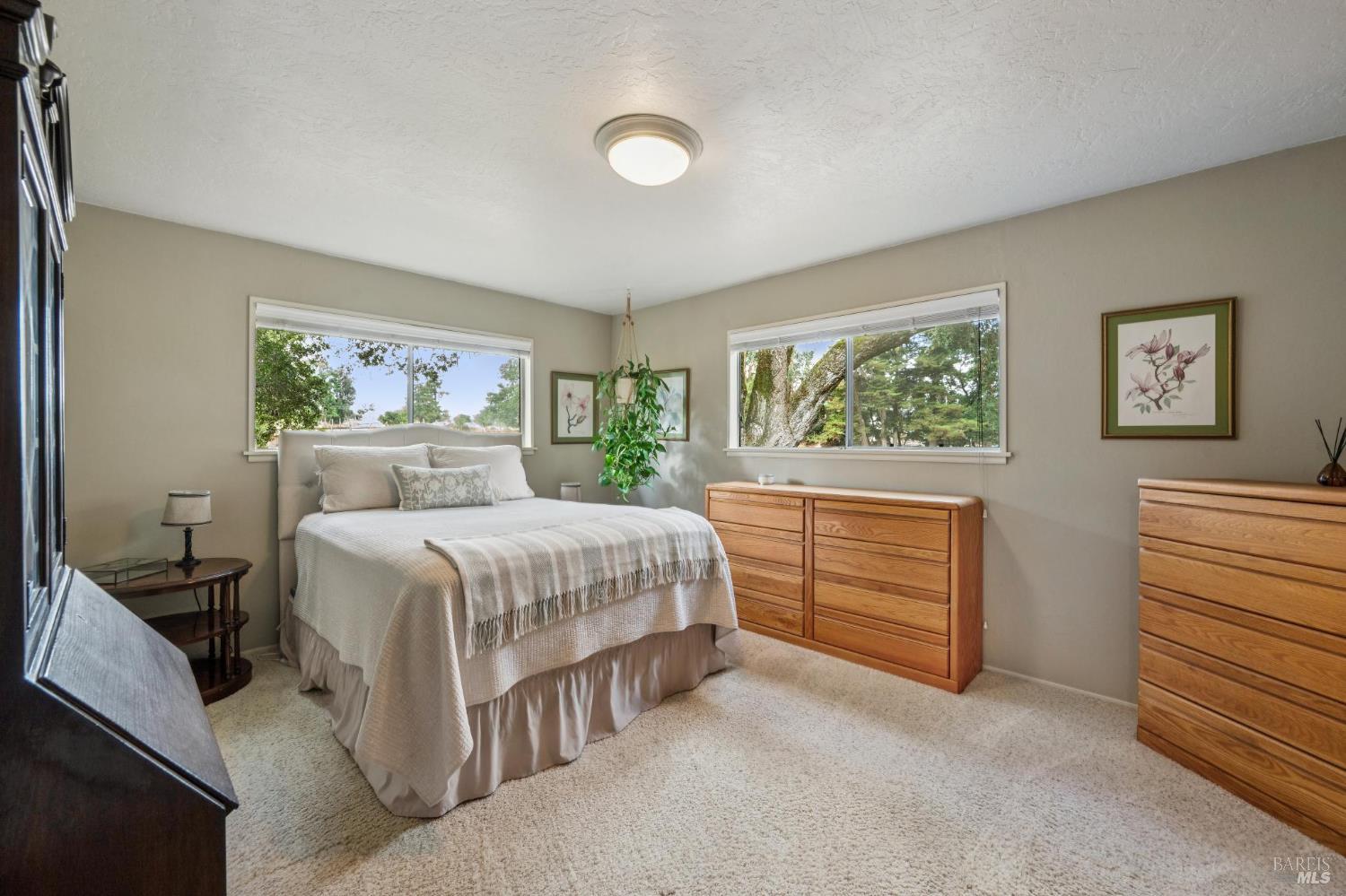 9760 Willow Avenue Cotati, CA 94931 - Photo 23 of 63 a bedroom with a bed and a dresser