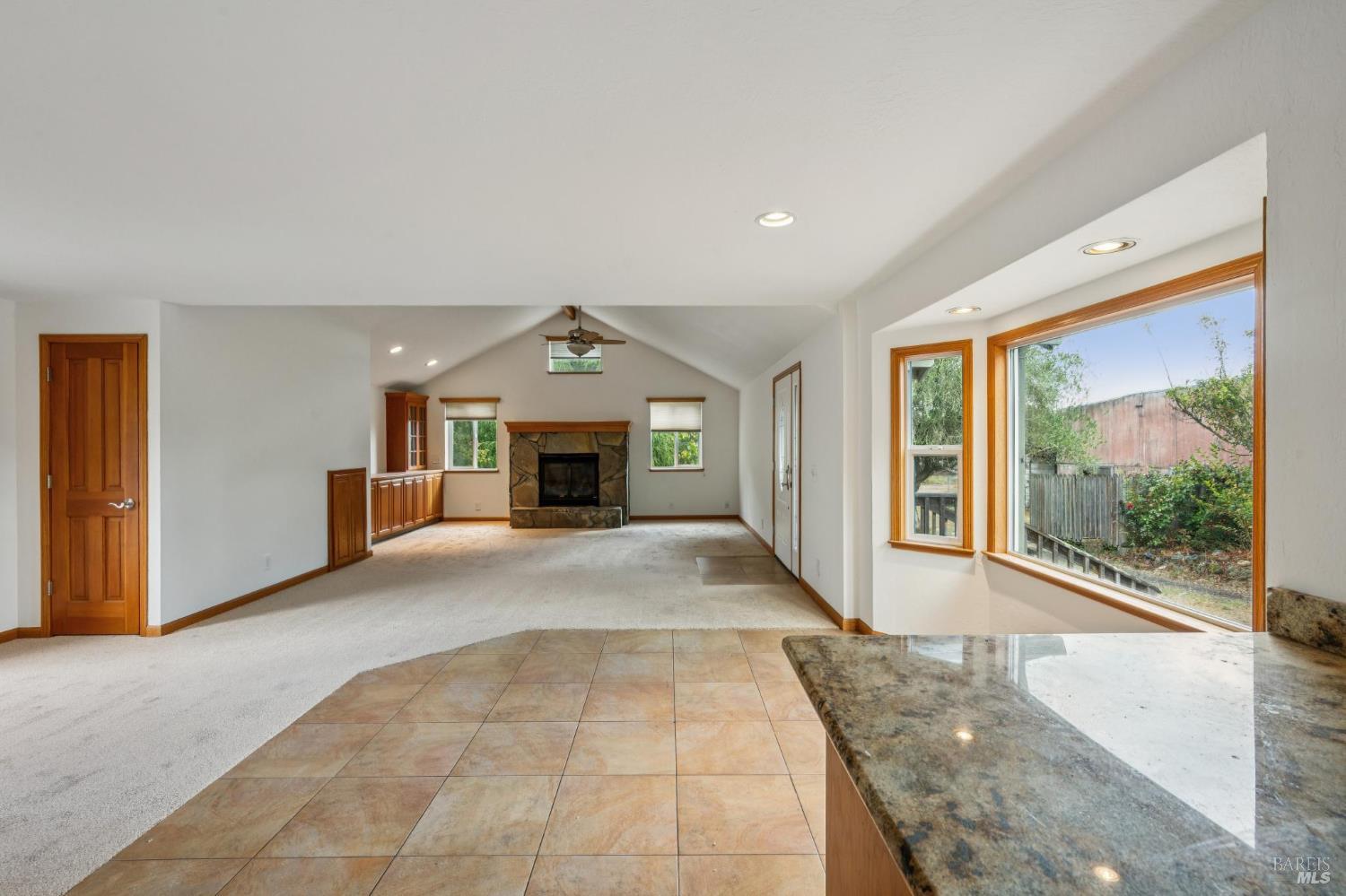 9760 Willow Avenue Cotati, CA 94931 - Photo 44 of 63 a view of empty room with a fireplace and windows