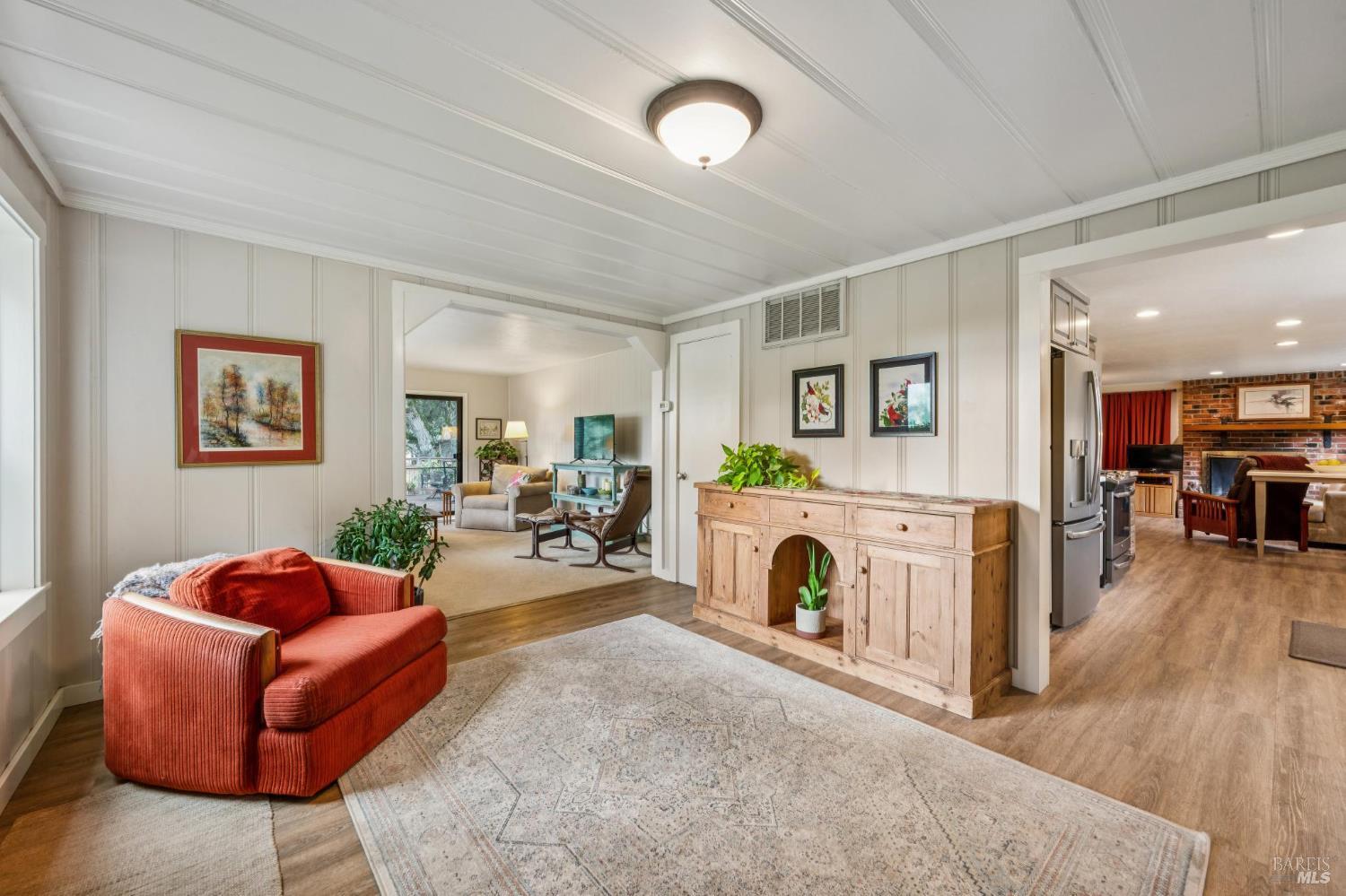 9760 Willow Avenue Cotati, CA 94931 - Photo 8 of 63 a living room with furniture a fireplace and a flat screen tv
