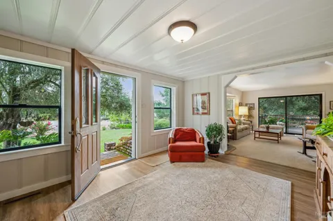 a room with furniture and large windows