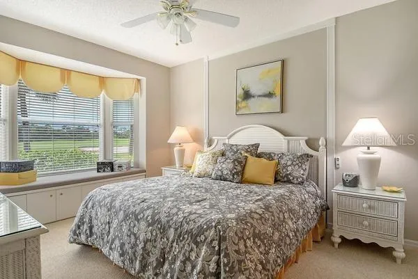 a bedroom with a bed and a night stand