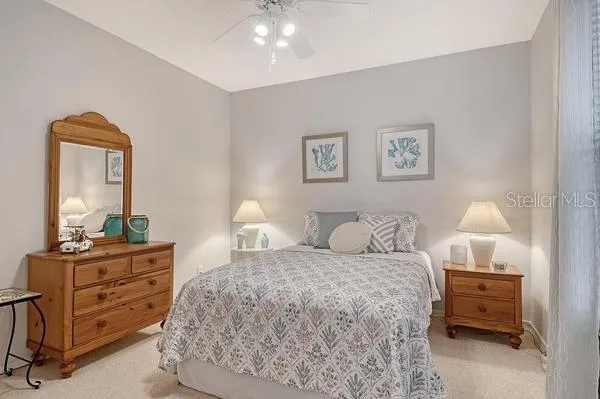 a bedroom with a bed and a dresser