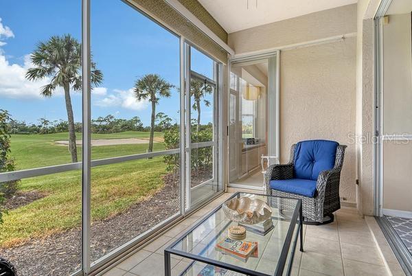 9641 Castle Point Drive, Unit 1215 Sarasota, FL 34238 - Photo 25 of 48 a view of a room with chairs and wooden floor