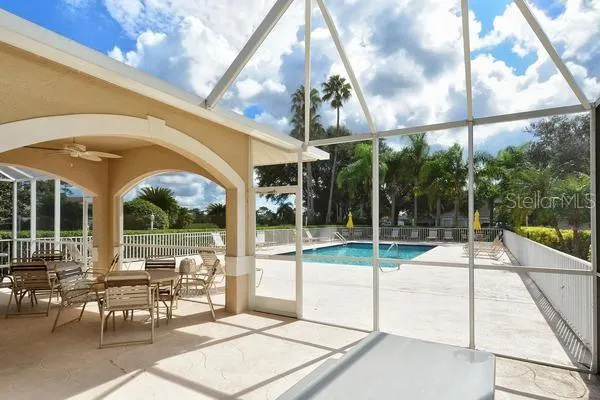 a view of a patio with a table and chairs