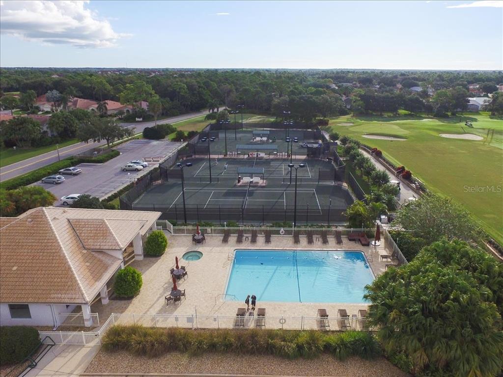 9641 Castle Point Drive, Unit 1215 Sarasota, FL 34238 - Photo 46 of 48 an aerial view of a house with a garden