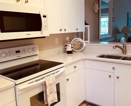 a kitchen with a stove and a microwave