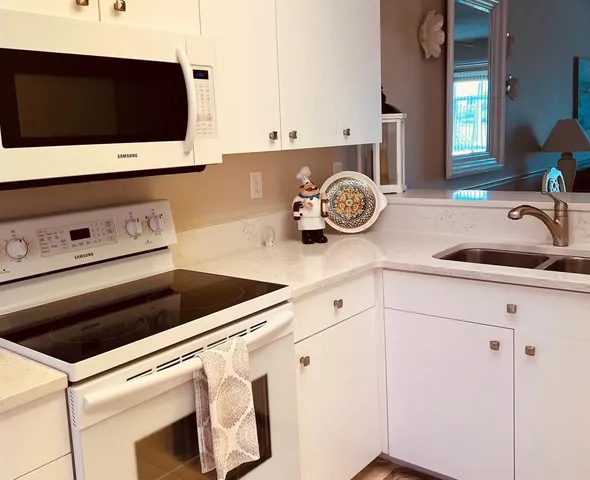a kitchen with a stove and a microwave