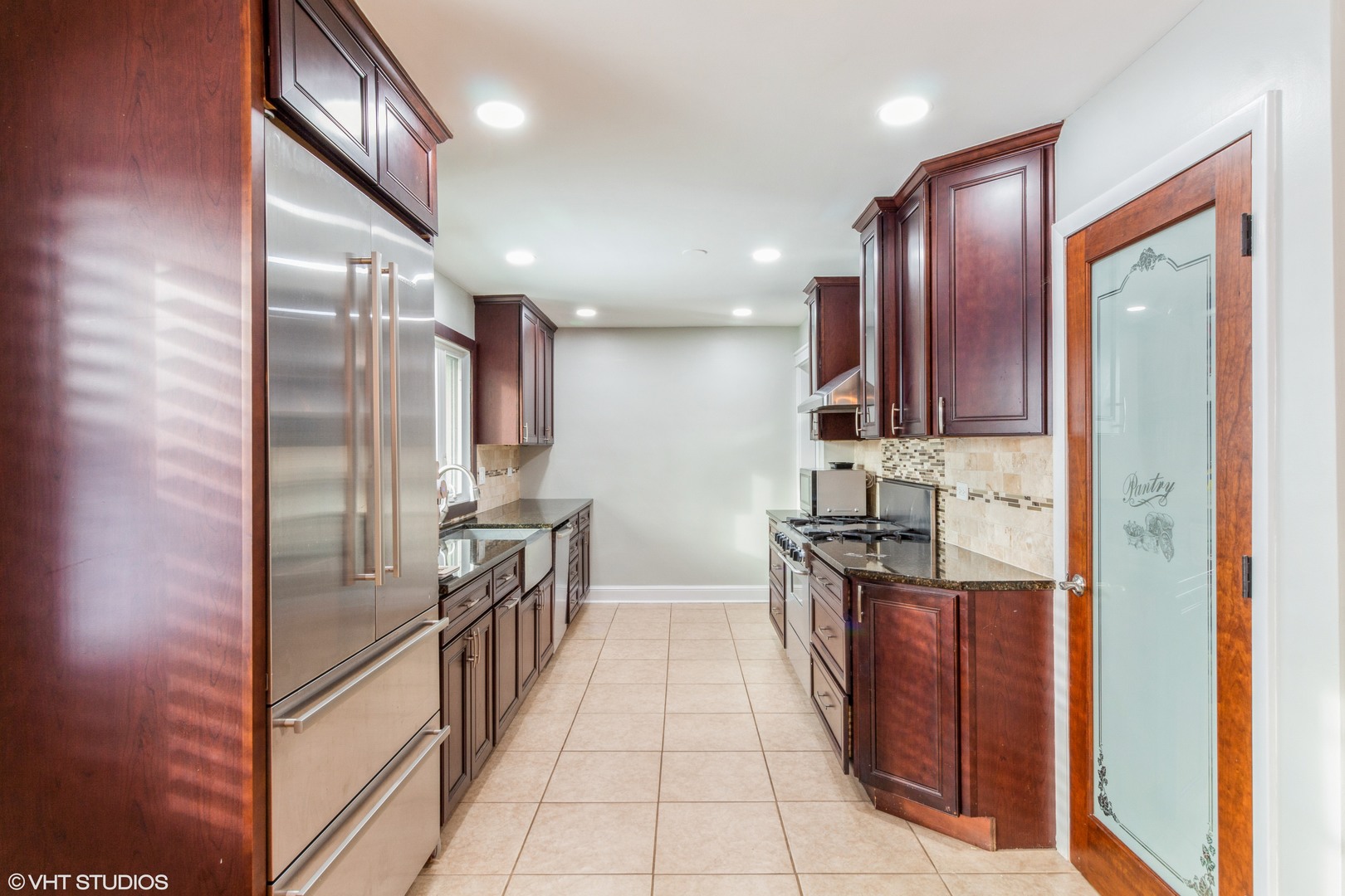 45 Haman Road Inverness, IL 60067 - Photo 3 of 11 a kitchen with stainless steel appliances granite countertop a refrigerator a stove and a sink