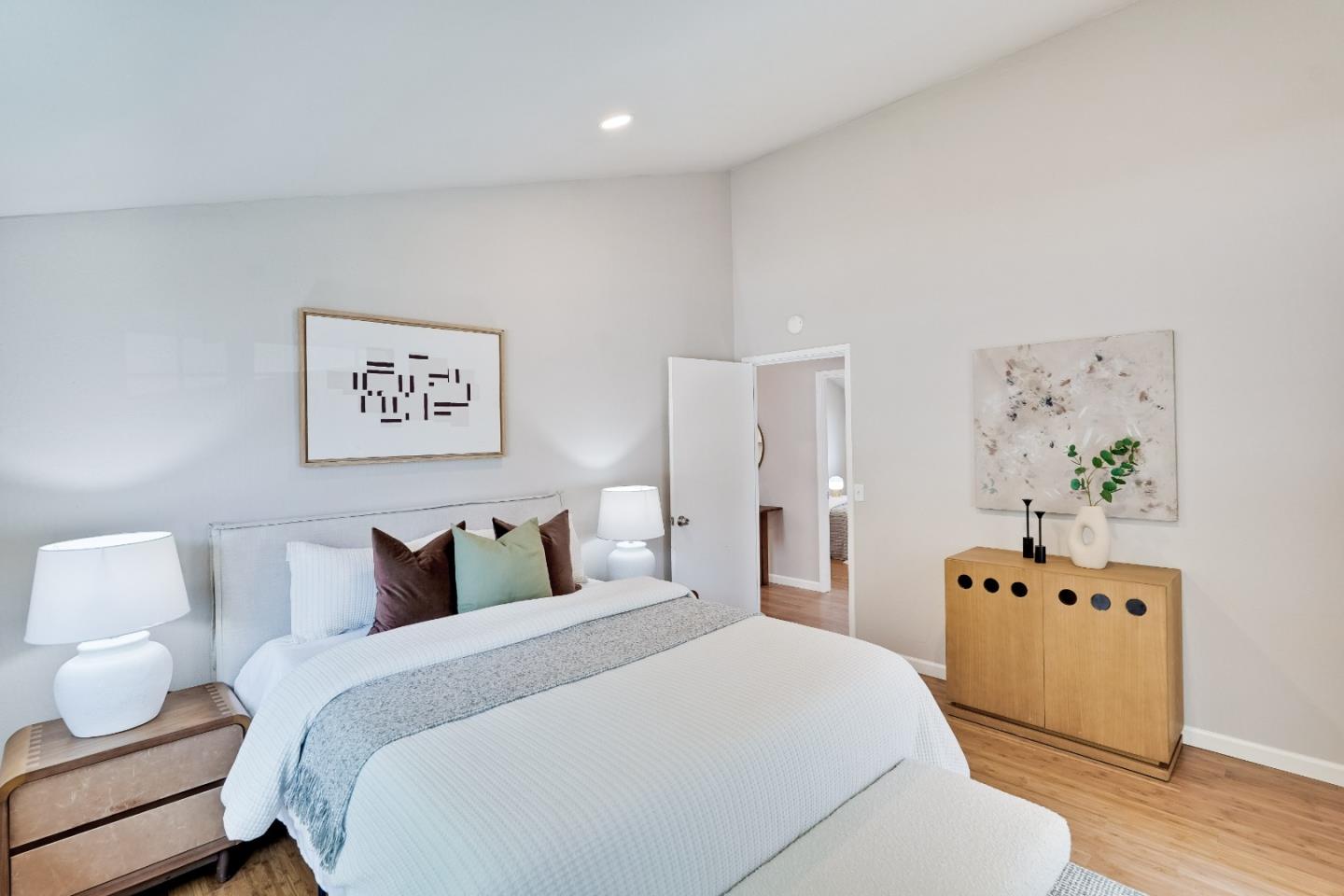 1755 Ravizza Avenue Santa Clara, CA 95051 - Photo 30 of 36 a bedroom with a bed and wooden floor