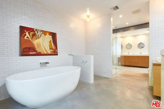 a white bath tub sitting in a bathroom