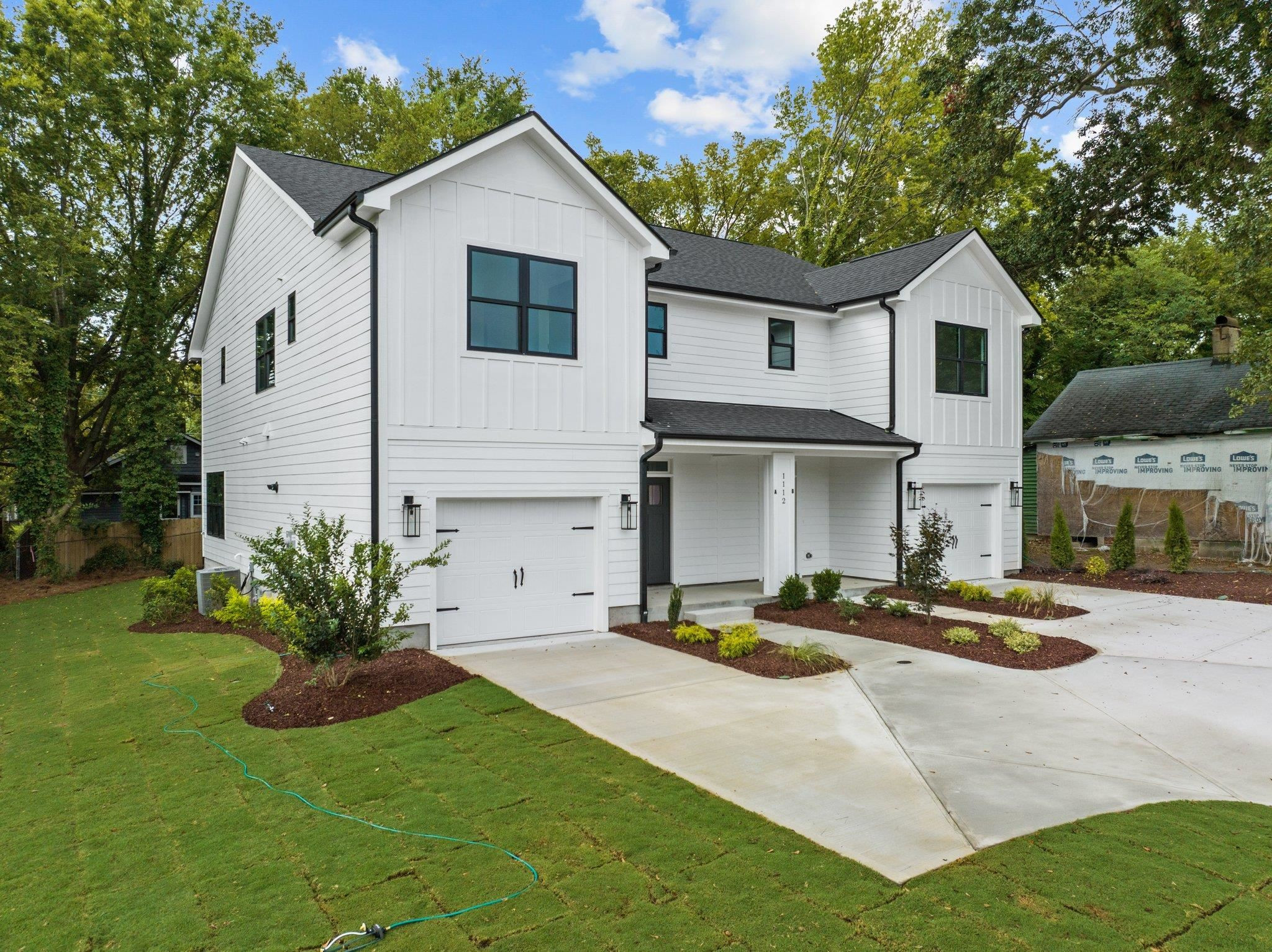 1112 Pender Street Raleigh, NC 27610 - Photo 2 of 56 a front view of a house with a yard