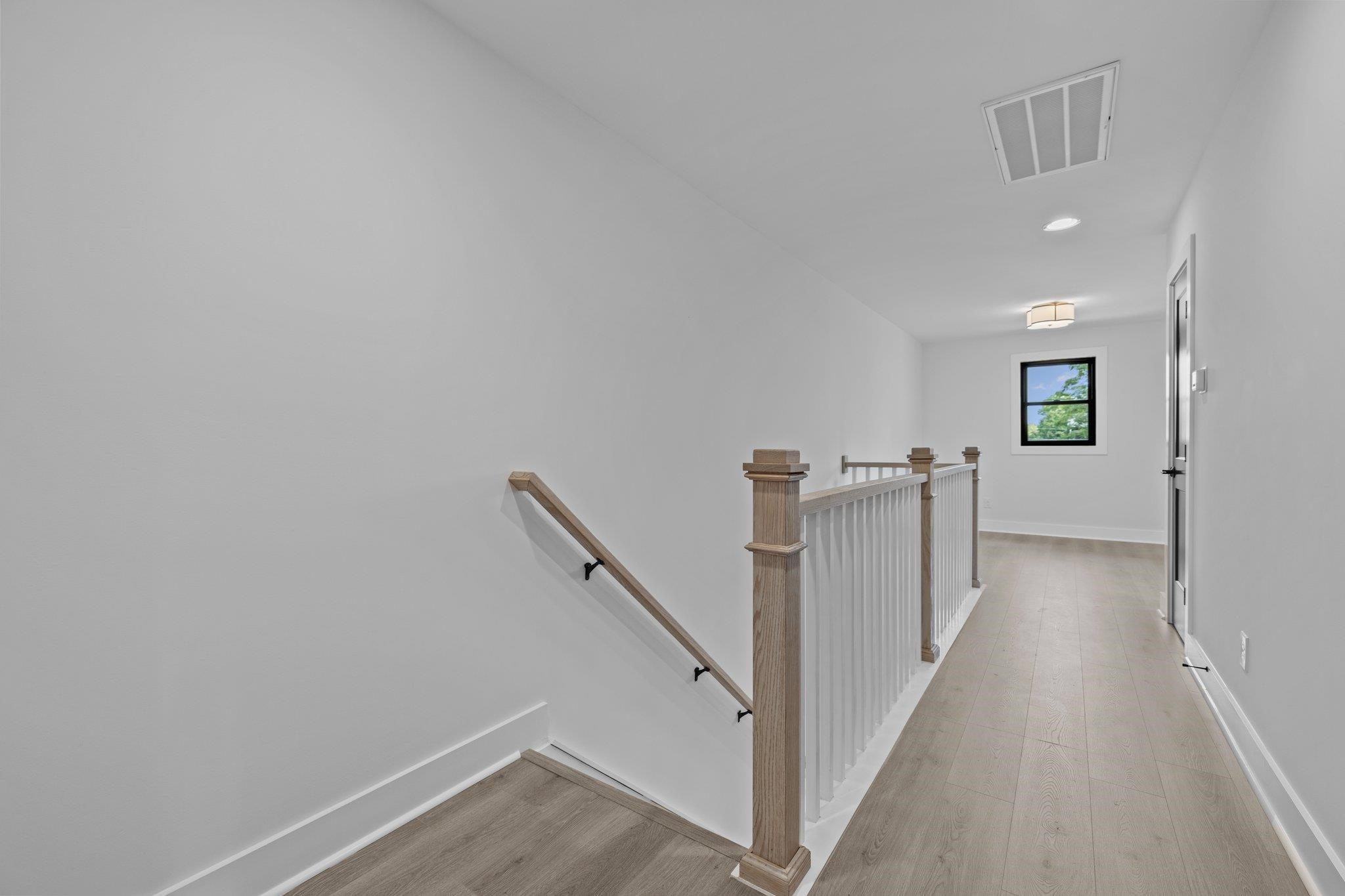1112 Pender Street Raleigh, NC 27610 - Photo 22 of 56 a view of a hallway with staircase