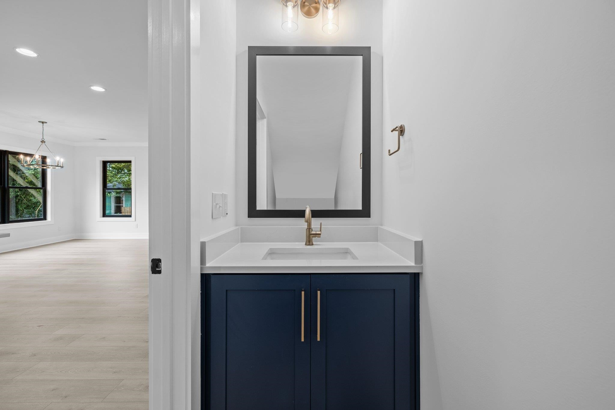 1112 Pender Street Raleigh, NC 27610 - Photo 24 of 56 a bathroom with a sink and a mirror