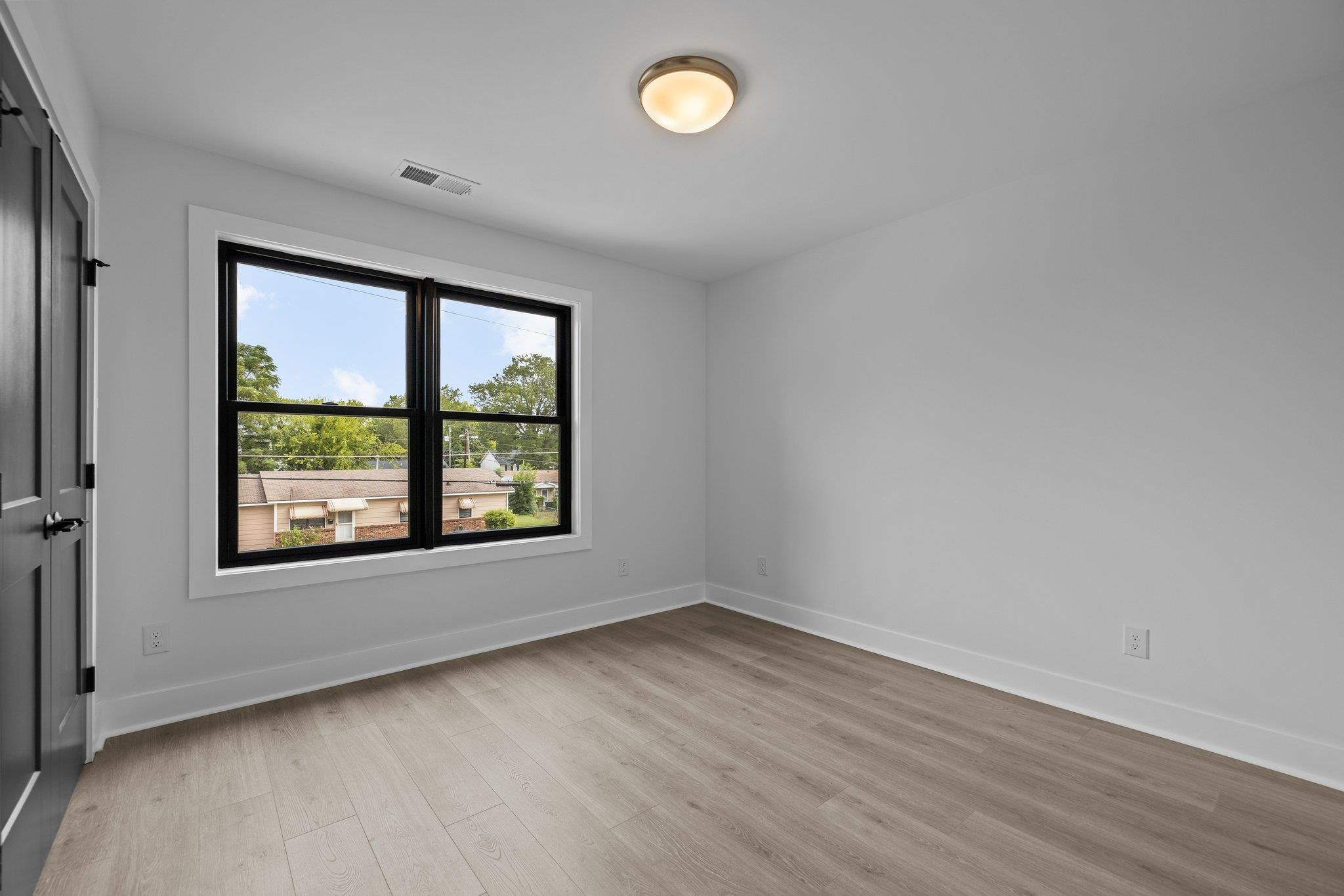 1112 Pender Street Raleigh, NC 27610 - Photo 29 of 56 an empty room with a window