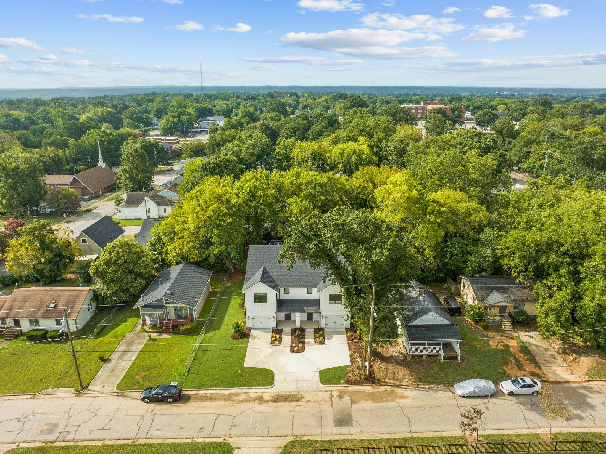 1112 Pender Street Raleigh, NC 27610 - Photo 40 of 56 an aerial view of a house with garden space and street view