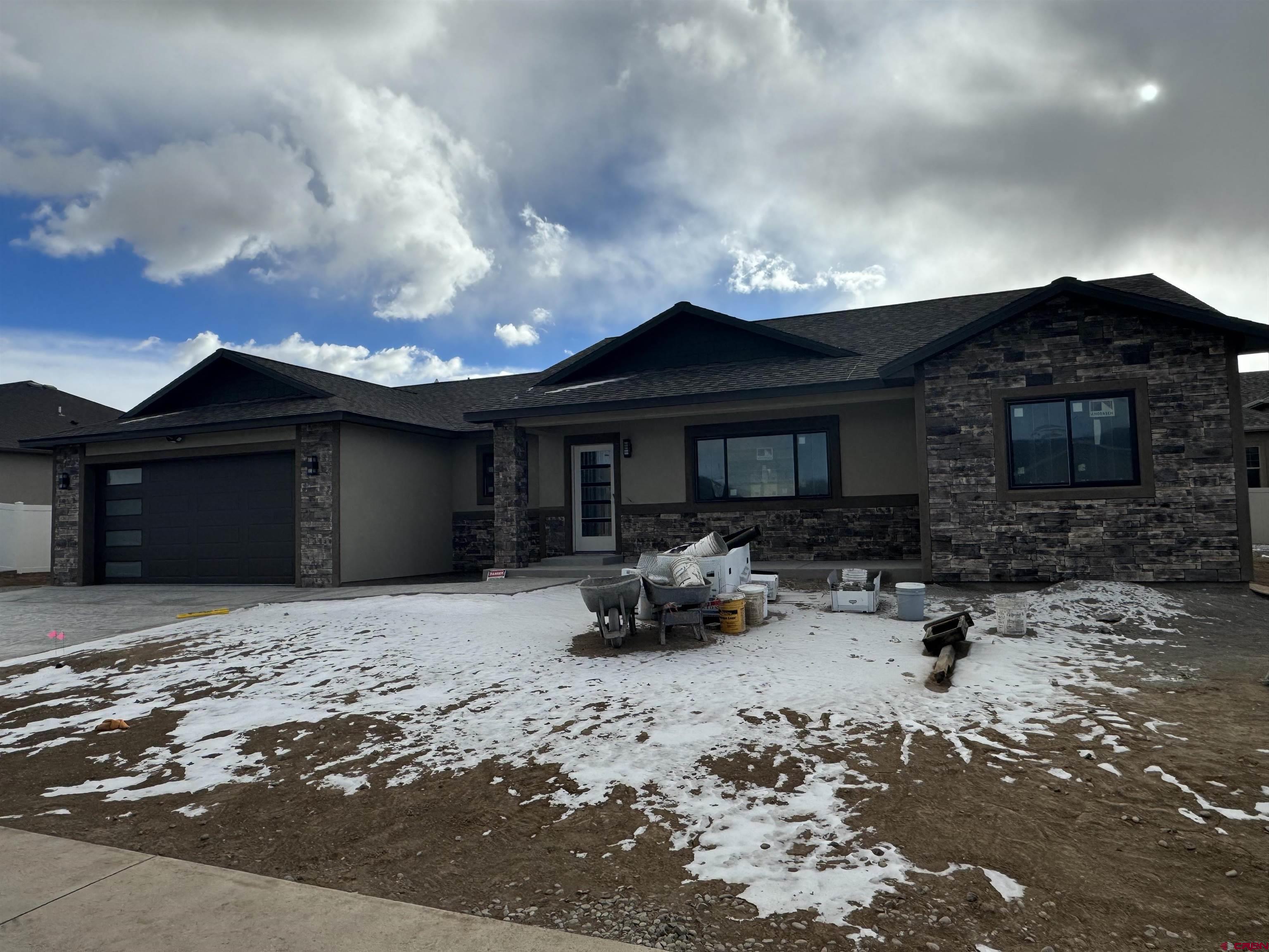a front view of a house with parking space