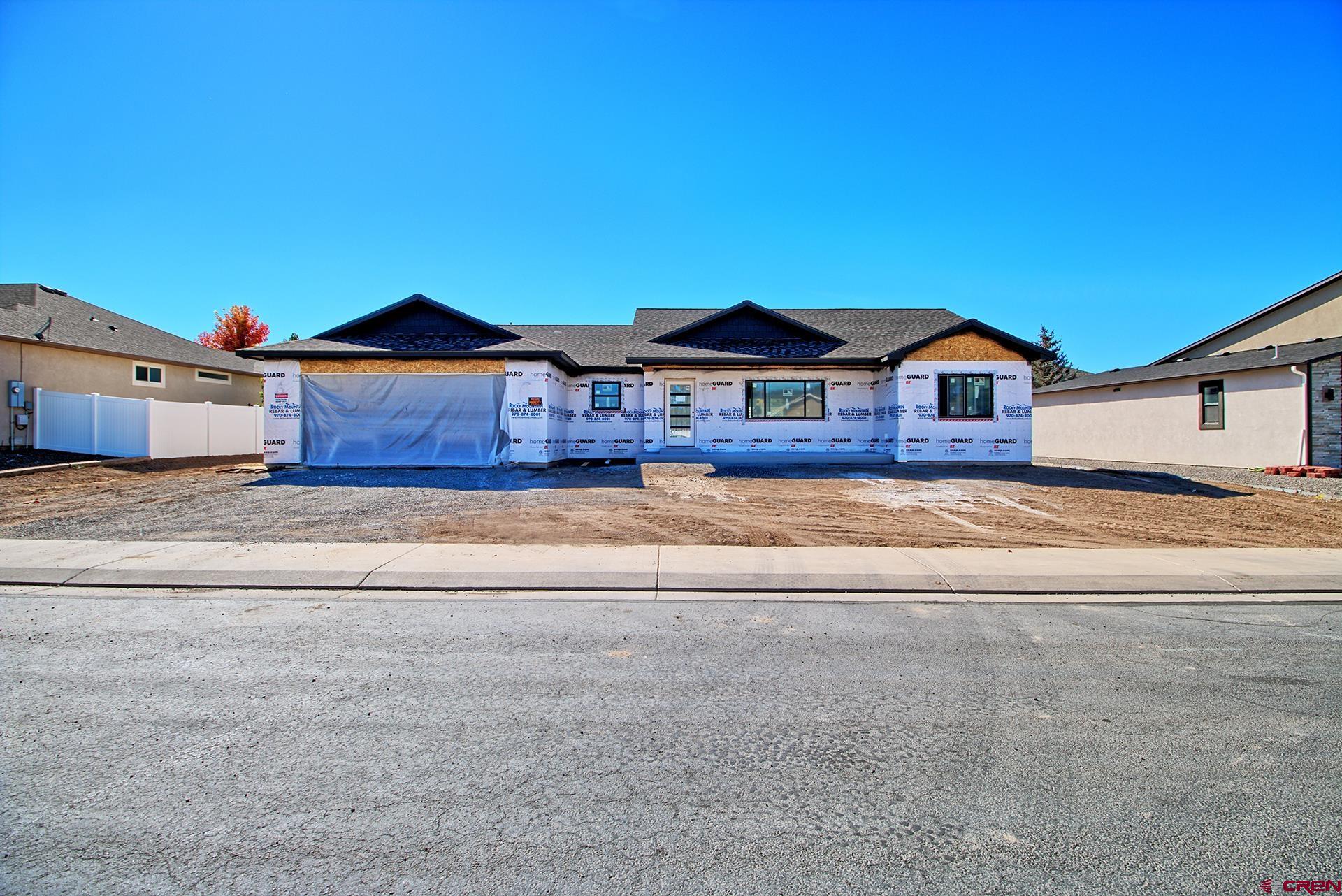 1746 Lynx Street Delta, CO 81416 - Photo 13 of 13 a front view of a house with a yard
